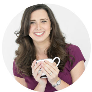 Photo of Joanna Platt smiling and holding a coffee mug